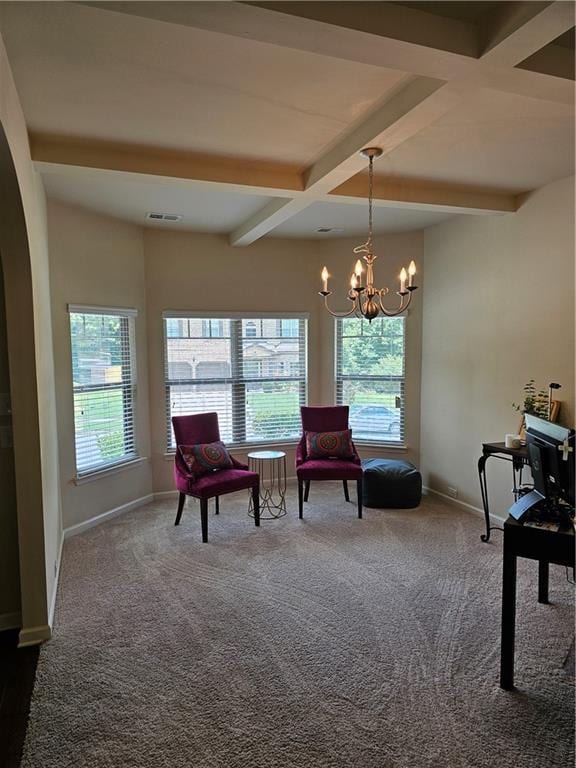 1750 Stone Meadow Rd, Lithonia, GA 30058 - living area with beam ceiling, dark carpet, a chandelier, and arched walkways