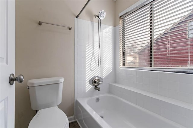 bathroom with shower / bath combination and toilet