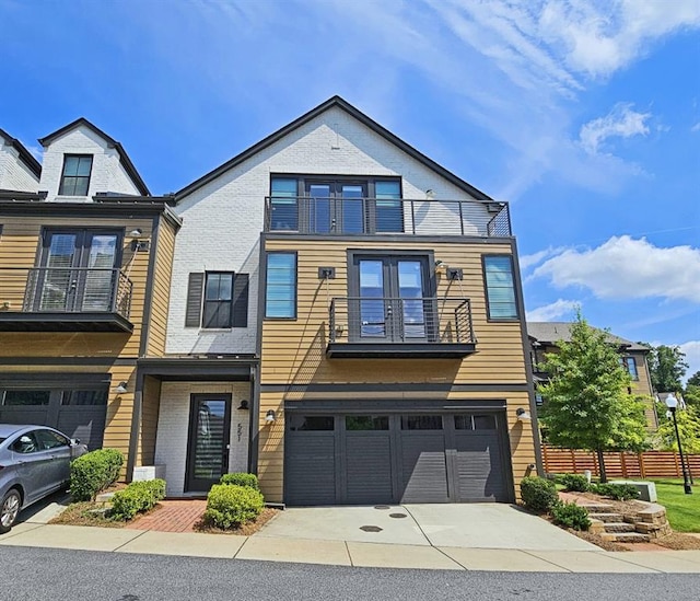 view of front of home with a balcony and a garage