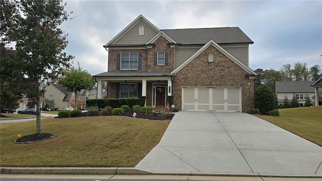 craftsman-style home with concrete driveway, a front lawn, brick siding, a porch, and a garage