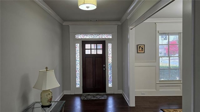 entrance foyer featuring healthy amount of natural light, dark wood-style floors, crown molding, and baseboards