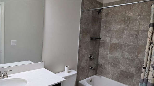 bathroom featuring vanity, shower / bath combo, and toilet