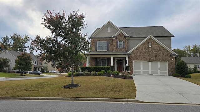 craftsman inspired home featuring concrete driveway, a front lawn, and brick siding