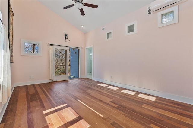 spare room featuring ceiling fan, high vaulted ceiling, wood finished floors, visible vents, and baseboards