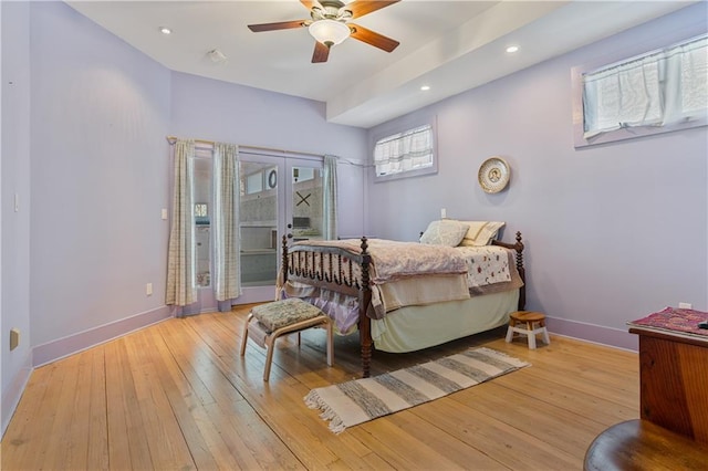 bedroom with recessed lighting, ceiling fan, light wood-style flooring, and baseboards