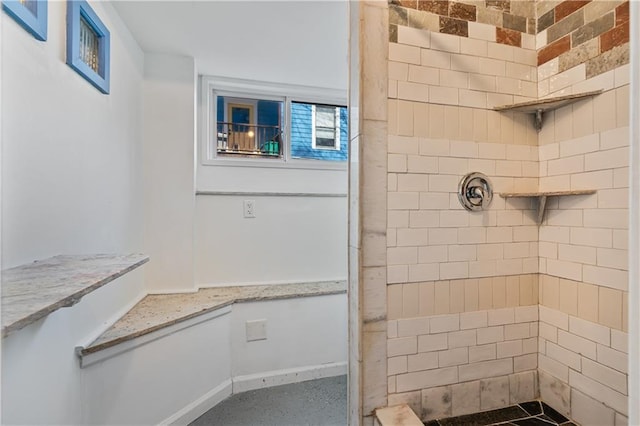 bathroom featuring a tile shower