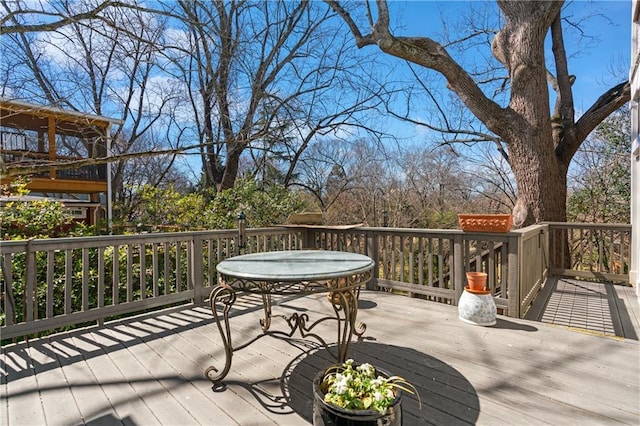 wooden deck with outdoor dining area