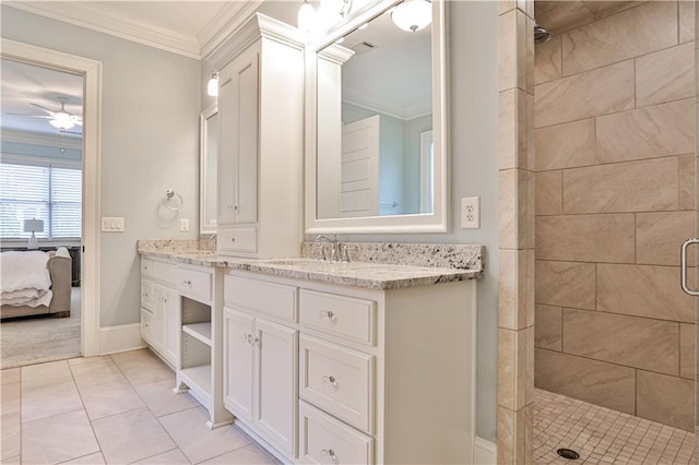 full bath with vanity, ornamental molding, a stall shower, ensuite bath, and a ceiling fan