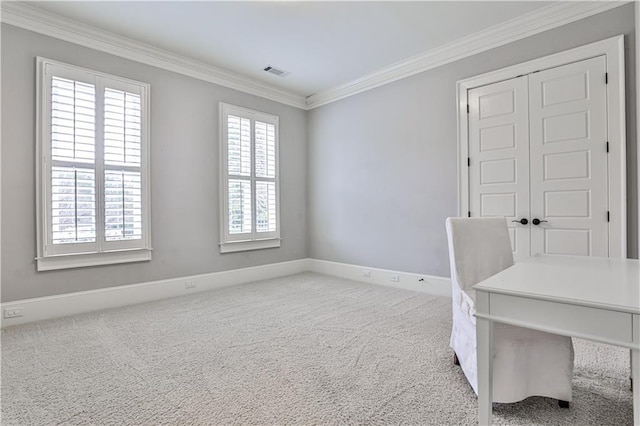office featuring visible vents, ornamental molding, baseboards, and carpet floors