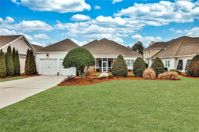 view of front of property with driveway, a front lawn, and a garage