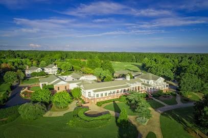 drone / aerial view with a wooded view