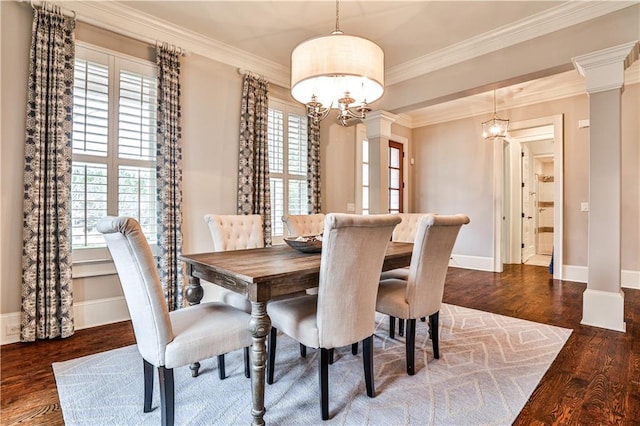 dining area featuring plenty of natural light, a chandelier, and crown molding