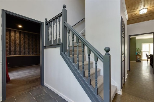 stairs with baseboards and ornamental molding