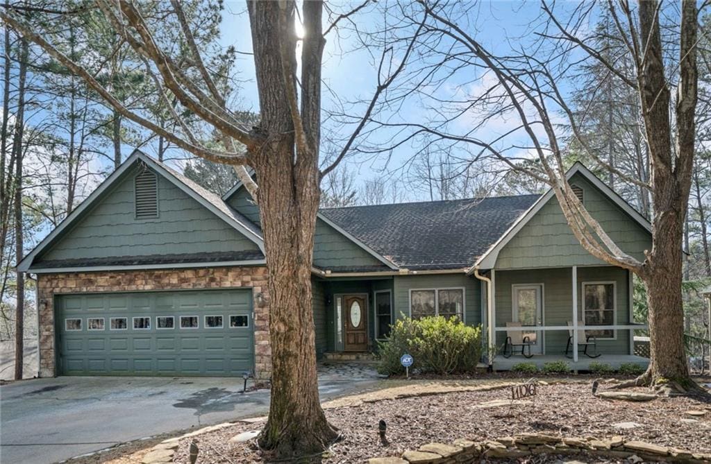 view of front of house featuring a porch and a garage