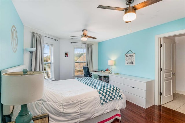 bedroom featuring wood-type flooring and ceiling fan