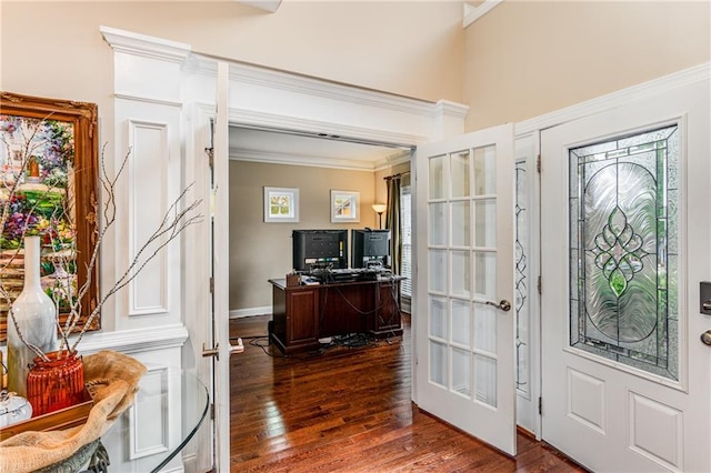 entryway with french doors, ornamental molding, and dark wood-type flooring