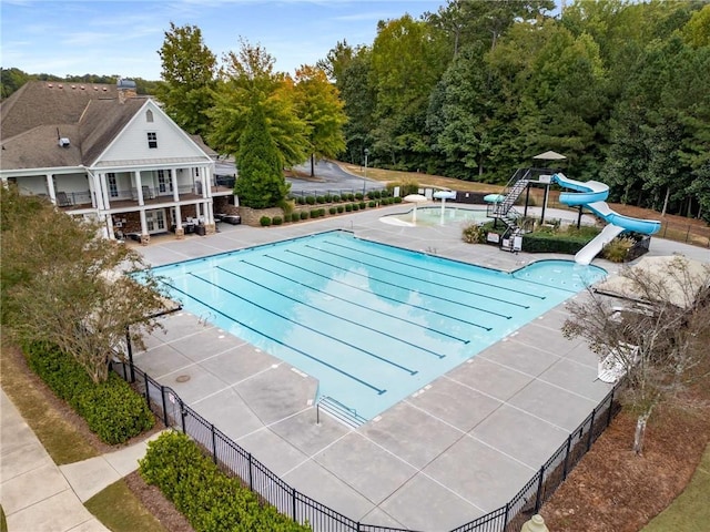 view of swimming pool featuring a patio area and a water slide