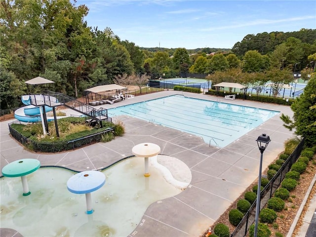 view of swimming pool featuring a patio area