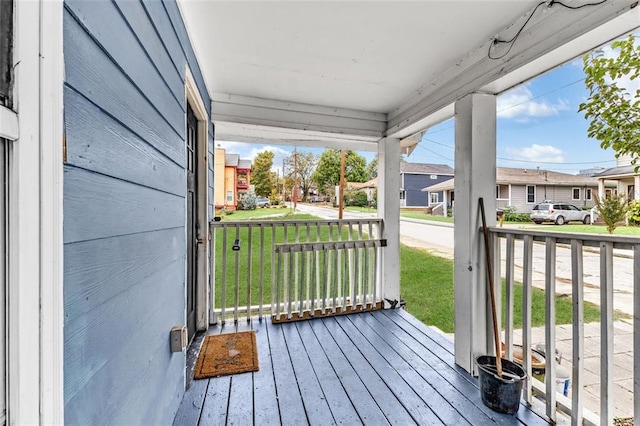 wooden deck featuring covered porch