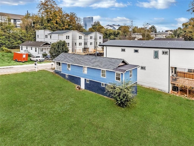 rear view of house with a yard