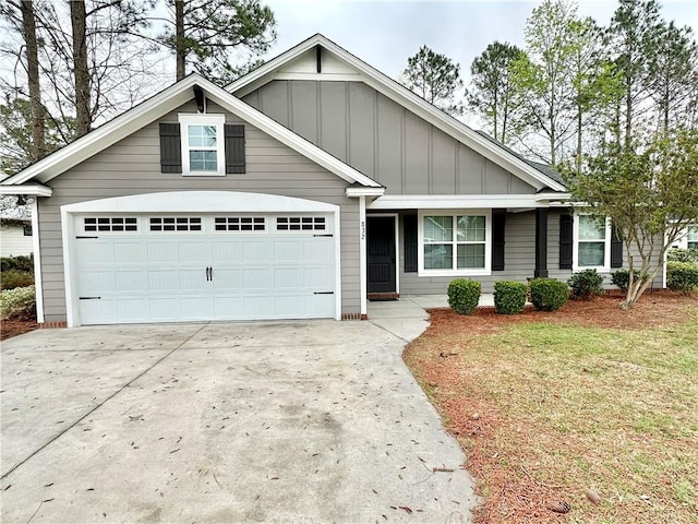 view of front of house featuring a garage and a front lawn