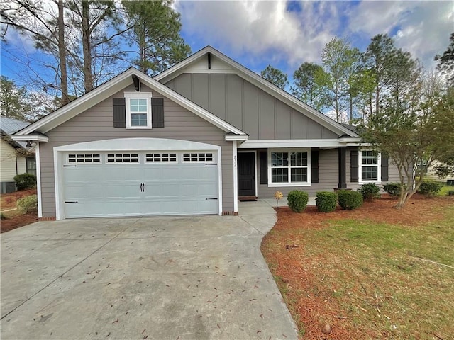 view of front of property with a front yard and central AC