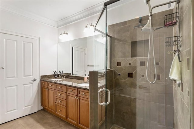 bathroom featuring double vanity, ornamental molding, a shower stall, and tile patterned floors