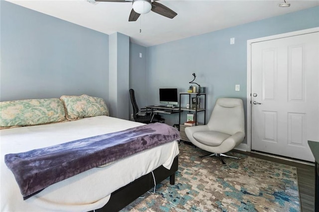 bedroom with a ceiling fan and wood finished floors