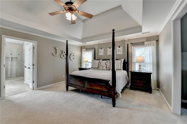 bedroom featuring light carpet, baseboards, a raised ceiling, and crown molding