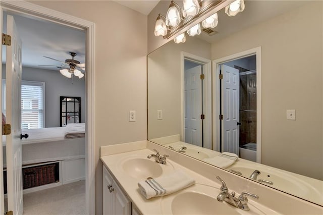 bathroom featuring double vanity, a sink, and visible vents