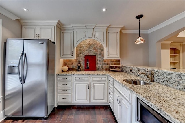 kitchen featuring stainless steel fridge with ice dispenser, ornamental molding, dark wood-type flooring, light stone countertops, and a sink