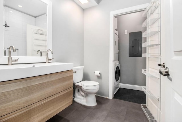 2230 Cheshire Bridge Rd NE Unit 401, Atlanta, GA 30324 - bathroom featuring electric panel, estacked washer and dryer, and vanity