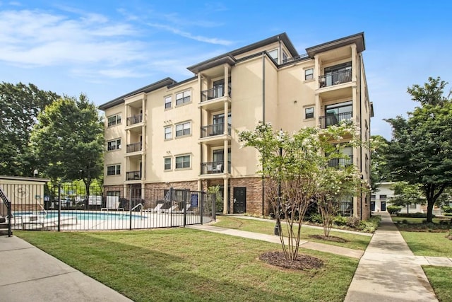 2230 Cheshire Bridge Rd NE Unit 401, Atlanta, GA 30324 - view of apartment building / complex featuring a community pool