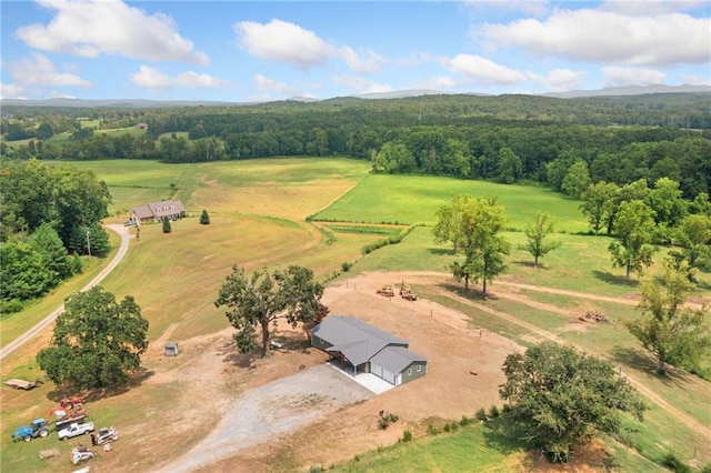 aerial view featuring a rural view and a view of trees