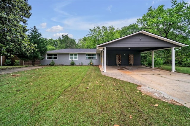 ranch-style house with concrete driveway and a front lawn