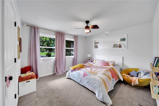 carpeted bedroom with baseboards and ceiling fan