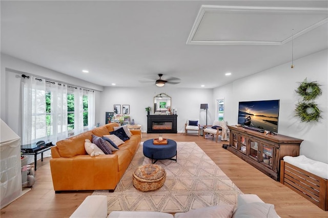 living area with recessed lighting, attic access, light wood-style floors, and ceiling fan