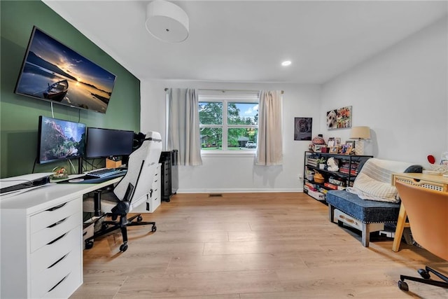 home office featuring recessed lighting, light wood-type flooring, and baseboards