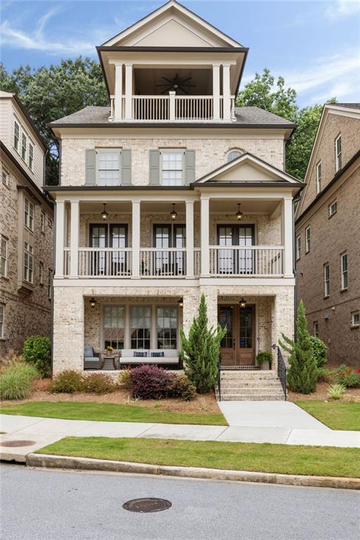 2110 Timball Rd NW, Atlanta, GA 30318 - greek revival inspired property with a balcony, french doors, and ceiling fan