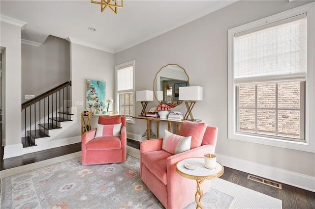 2110 Timball Rd NW, Atlanta, GA 30318 - living area with ornamental molding, stairs, baseboards, and wood finished floors