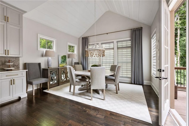 2110 Timball Rd NW, Atlanta, GA 30318 - dining area featuring a chandelier, dark wood-style floors, vaulted ceiling, french doors, and baseboards