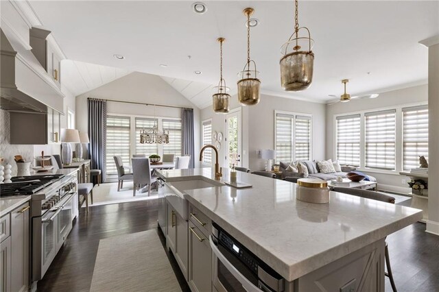 2110 Timball Rd NW, Atlanta, GA 30318 - kitchen featuring a sink, appliances with stainless steel finishes, plenty of natural light, an island with sink, and lofted ceiling