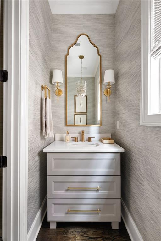 2110 Timball Rd NW, Atlanta, GA 30318 - bathroom featuring baseboards, vanity, and wallpapered walls