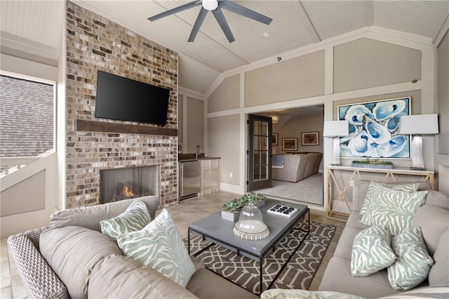 2110 Timball Rd NW, Atlanta, GA 30318 - living room featuring a ceiling fan, a brick fireplace, and high vaulted ceiling