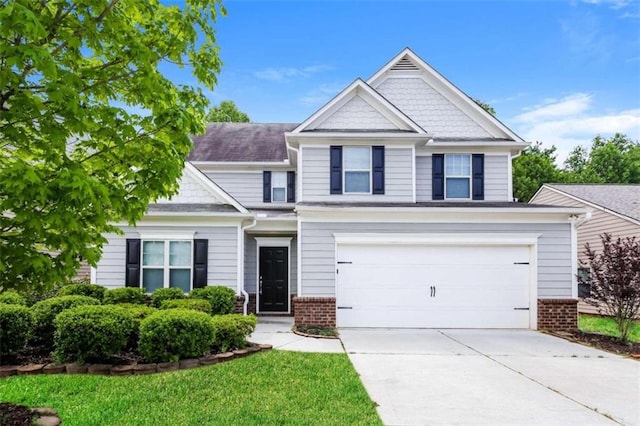 craftsman-style home featuring driveway, brick siding, and an attached garage