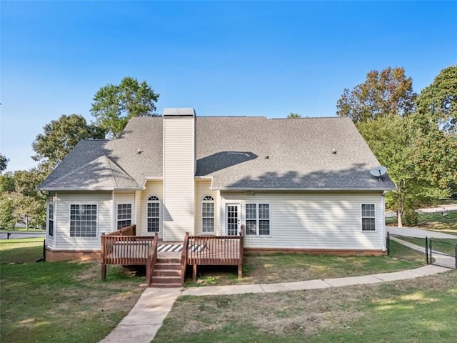 back of house with a deck, fence, a yard, crawl space, and a chimney