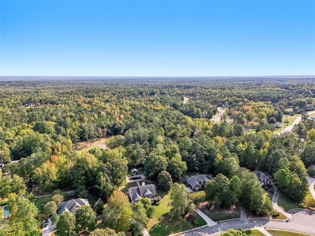 bird's eye view featuring a forest view