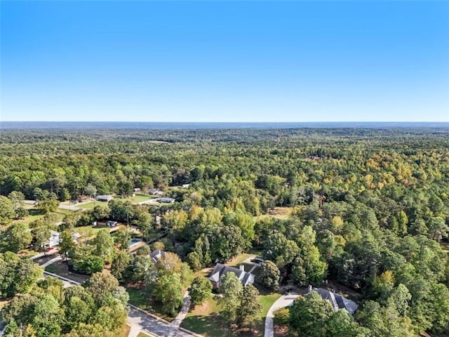 aerial view with a wooded view