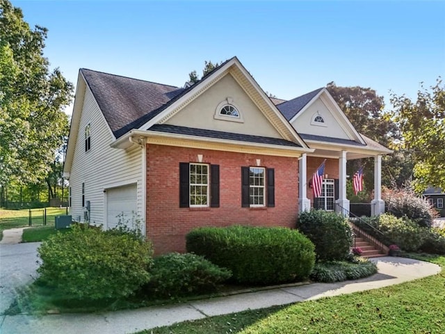 view of front of house with a garage and brick siding