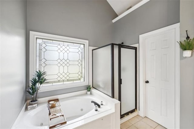 9435 Grande Dr, Winston, GA 30187 - bathroom with tile patterned flooring, a tub with jets, high vaulted ceiling, and a stall shower